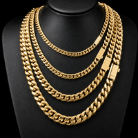 Gold Cuban link chains in four widths on a display bust - Showtime Gems