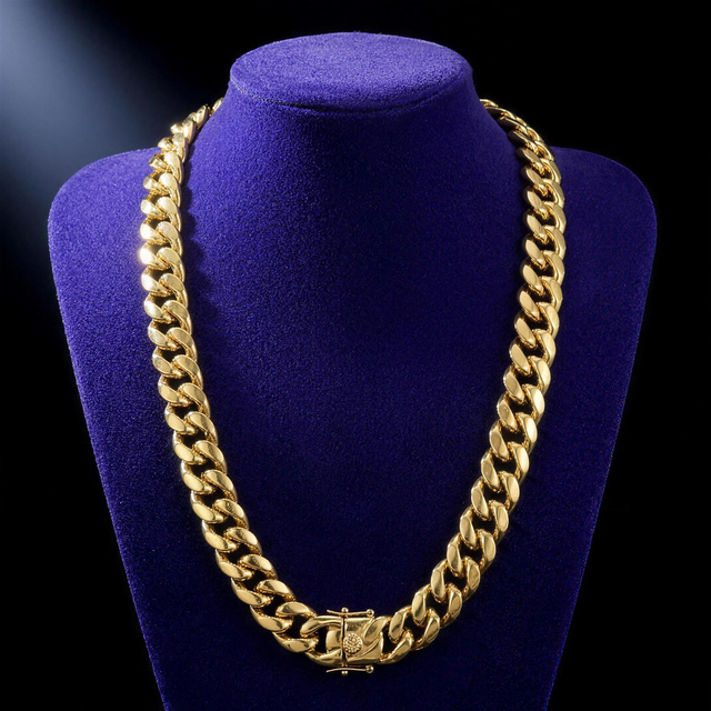Miami Cuban link chain 8-14mm 18K gold PVD on royal purple velvet bust, 22 inch drape, plain box clasp with round engraved medallion - Showtime Gems