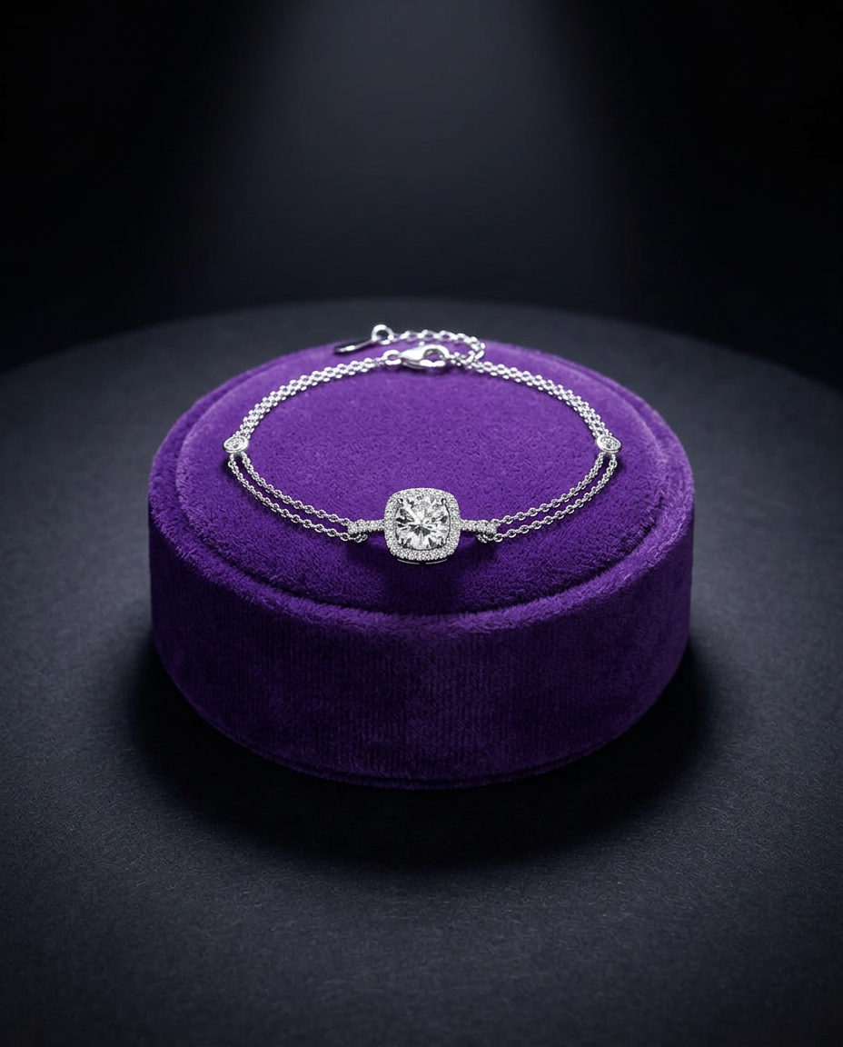 Moissanite tennis bracelet with halo center stone on royal purple velvet — Showtime Gems