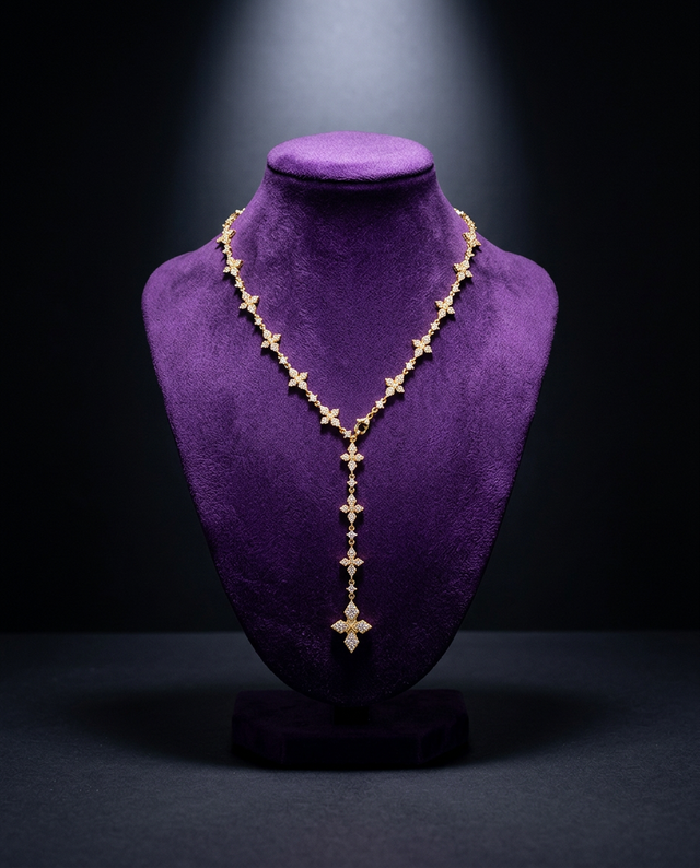 Iced CZ cross lariat Y-necklace on royal purple velvet bust — Showtime Gems