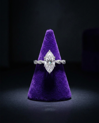 Marquise moissanite engagement ring on royal purple velvet cone — Showtime Gems