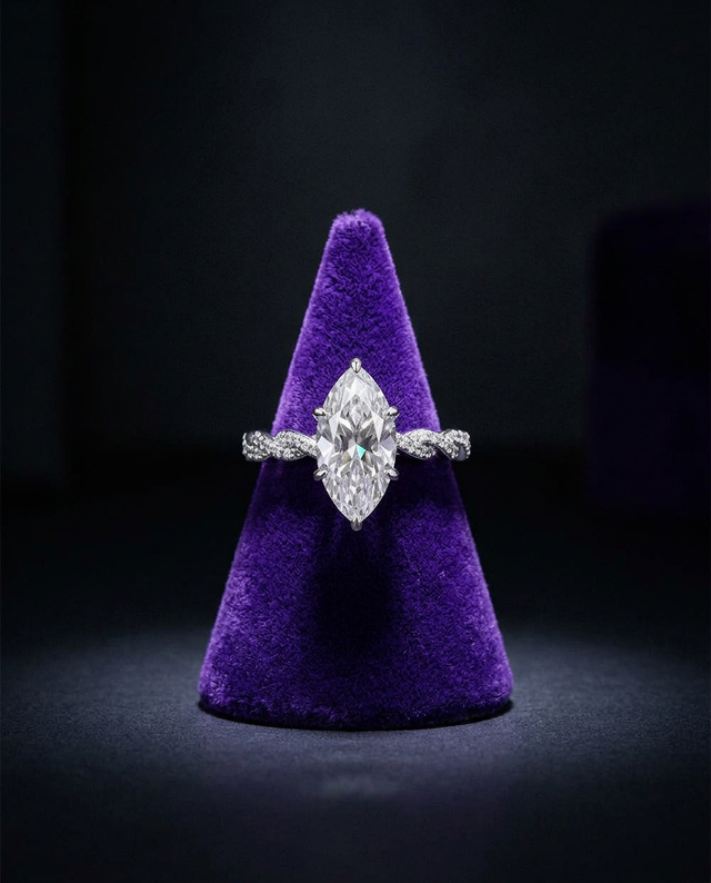 Marquise moissanite engagement ring on royal purple velvet cone — Showtime Gems