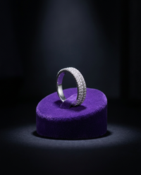 Moissanite wedding ring on royal purple velvet cone — Showtime Gems