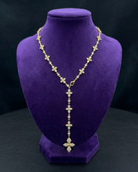Iced CZ cross lariat Y-necklace on royal purple velvet bust — Showtime Gems
