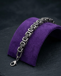 Byzantine chain bracelet on royal purple velvet ramp — Showtime Gems