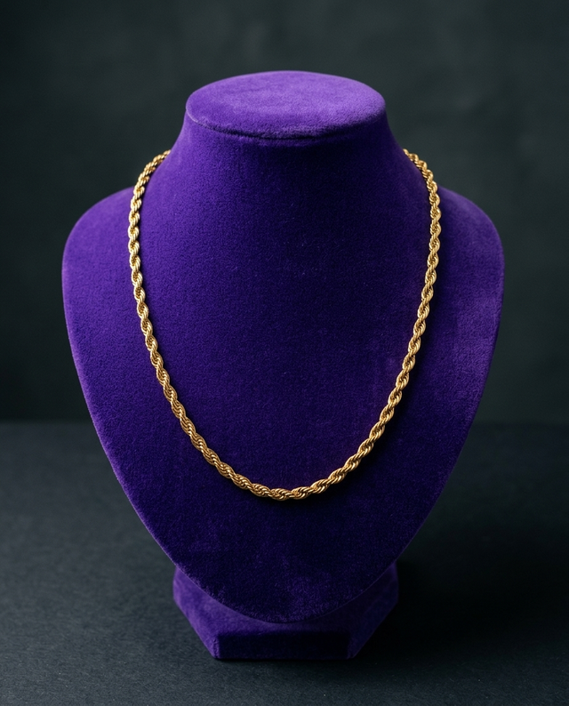 Gold rope chain necklace on royal purple velvet bust — Showtime Gems