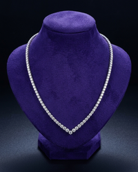 V-style moissanite tennis necklace on royal purple velvet bust — Showtime Gems