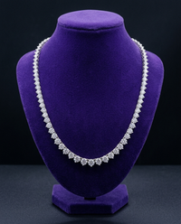 3-claw graduated moissanite tennis necklace on royal purple velvet bust — Showtime Gems