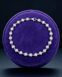 3mm bezel moissanite tennis bracelet on royal purple velvet ramp — Showtime Gems