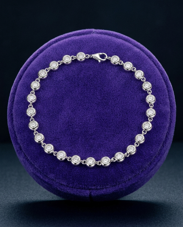 3mm bezel moissanite tennis bracelet on royal purple velvet ramp — Showtime Gems