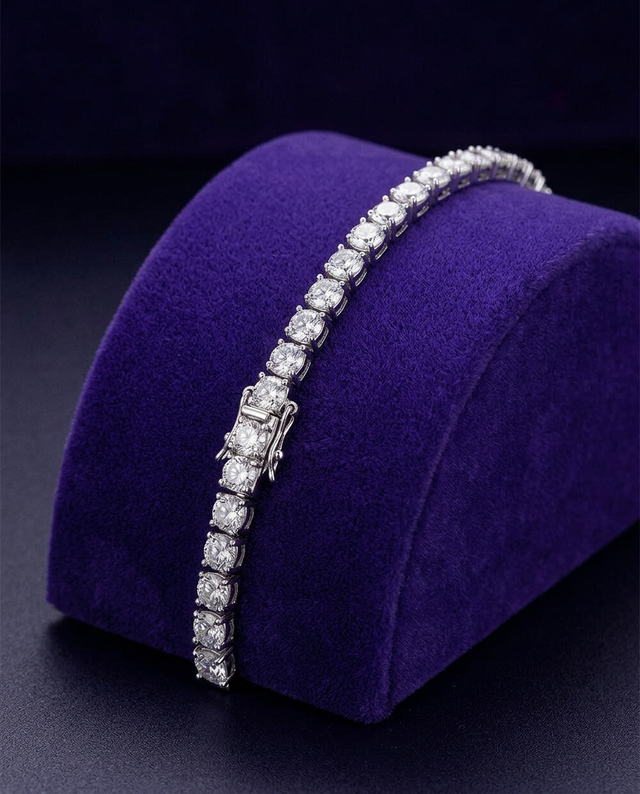 Classic 4-prong moissanite tennis bracelet on royal purple velvet ramp — Showtime Gems