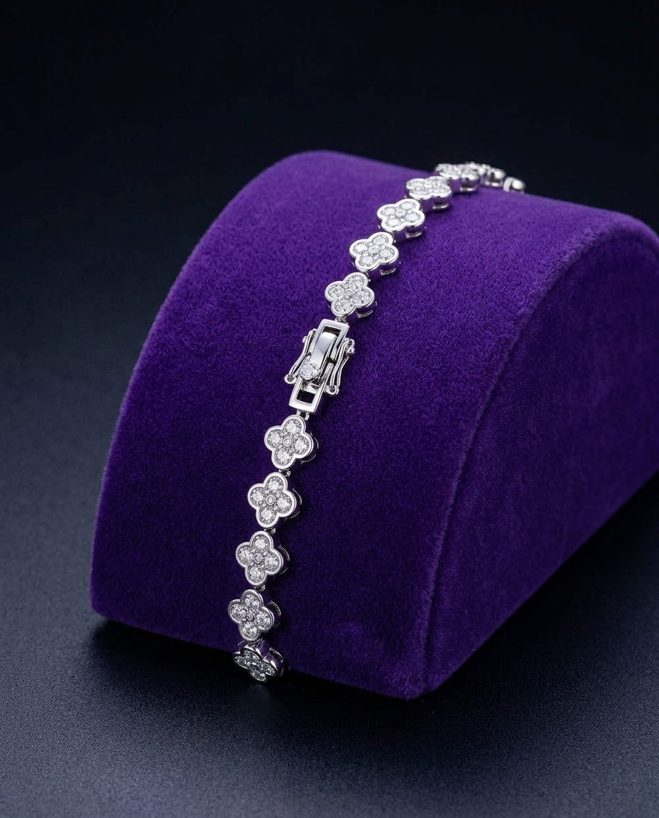 Four-leaf clover moissanite bracelet on royal purple velvet ramp — Showtime Gems