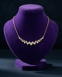ATTAGEMS gold cluster moissanite necklace on royal purple velvet bust — Showtime Gems