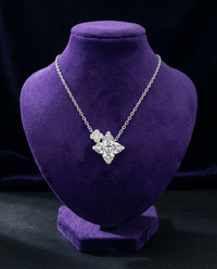 ATTAGEMS clover-cut moissanite necklace on royal purple velvet bust — Showtime Gems