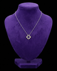 Two-Tone Clover Moissanite Necklace necklace on royal purple velvet — Showtime Gems