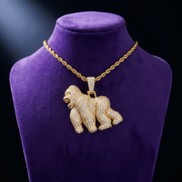 Moissanite Gorilla Pendant necklace in 18K gold on royal purple velvet — Showtime Gems