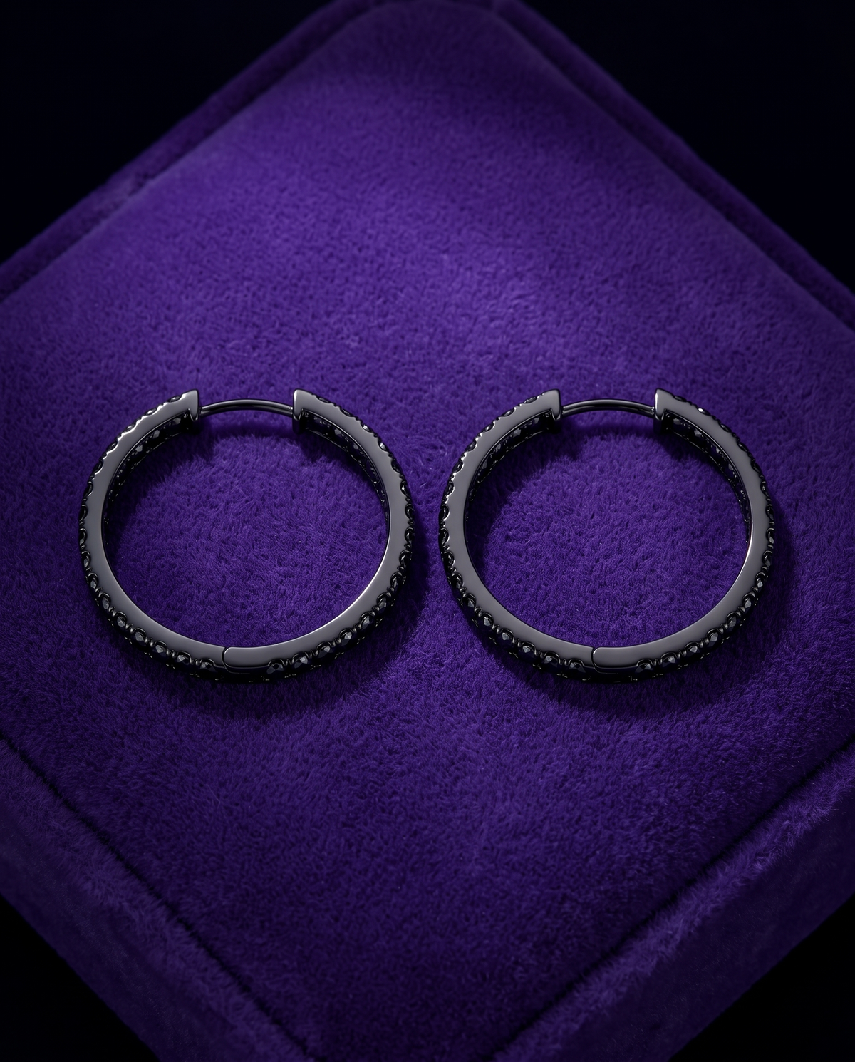 Black Moissanite Hoop & Huggie Earrings (925 Silver) earrings on royal purple velvet — Showtime Gems