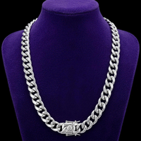 Miami Cuban link chain silver non-tarnish steel on velvet bust, shorter drape, plain box clasp with round engraved medallion - Showtime Gems