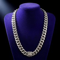 Miami Cuban link chain 8-14mm silver non-tarnish steel on royal purple velvet bust, 22 inch drape, plain box clasp with round engraved medallion - Showtime Gems